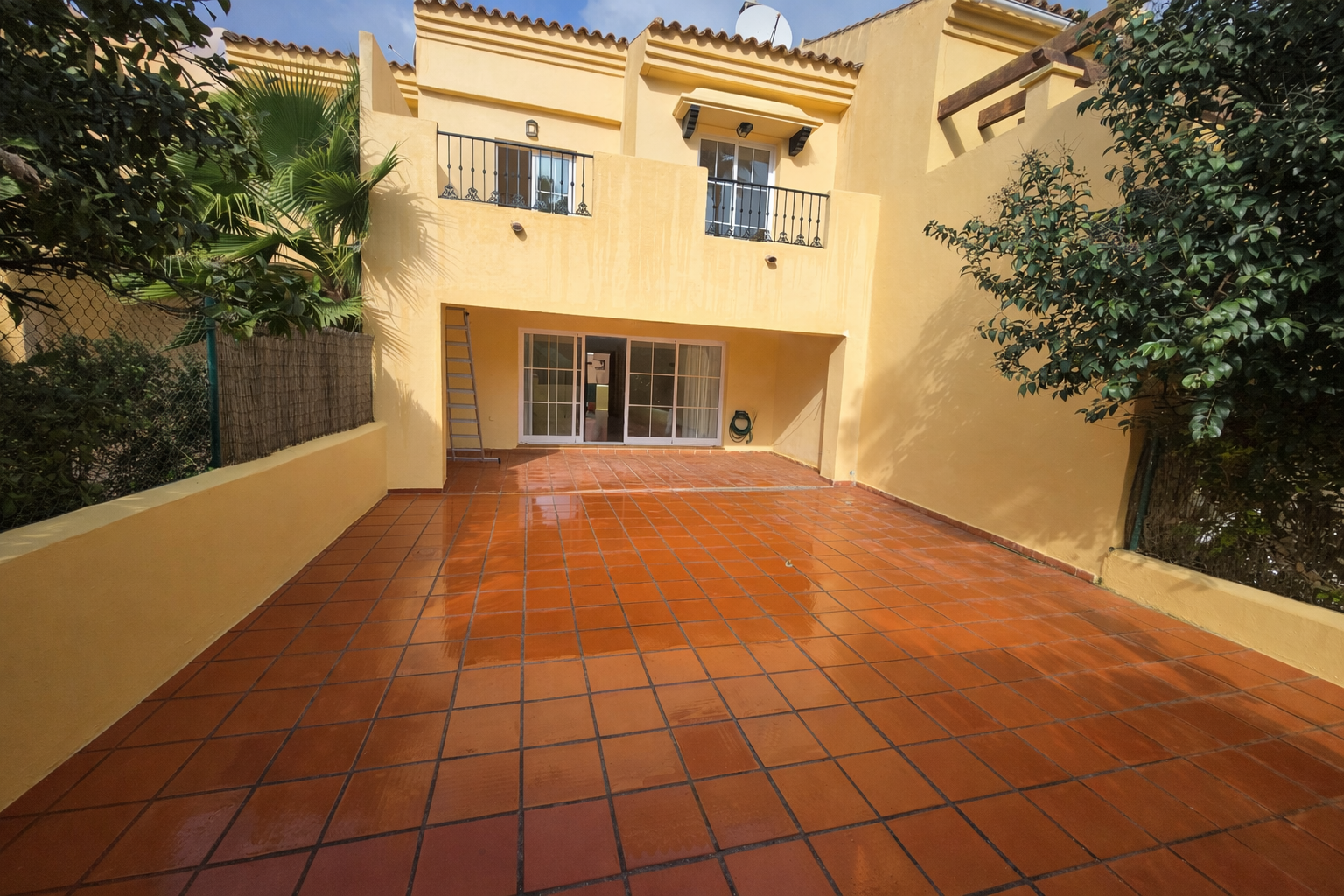Mediterranean townhouse with vibrant patio.png